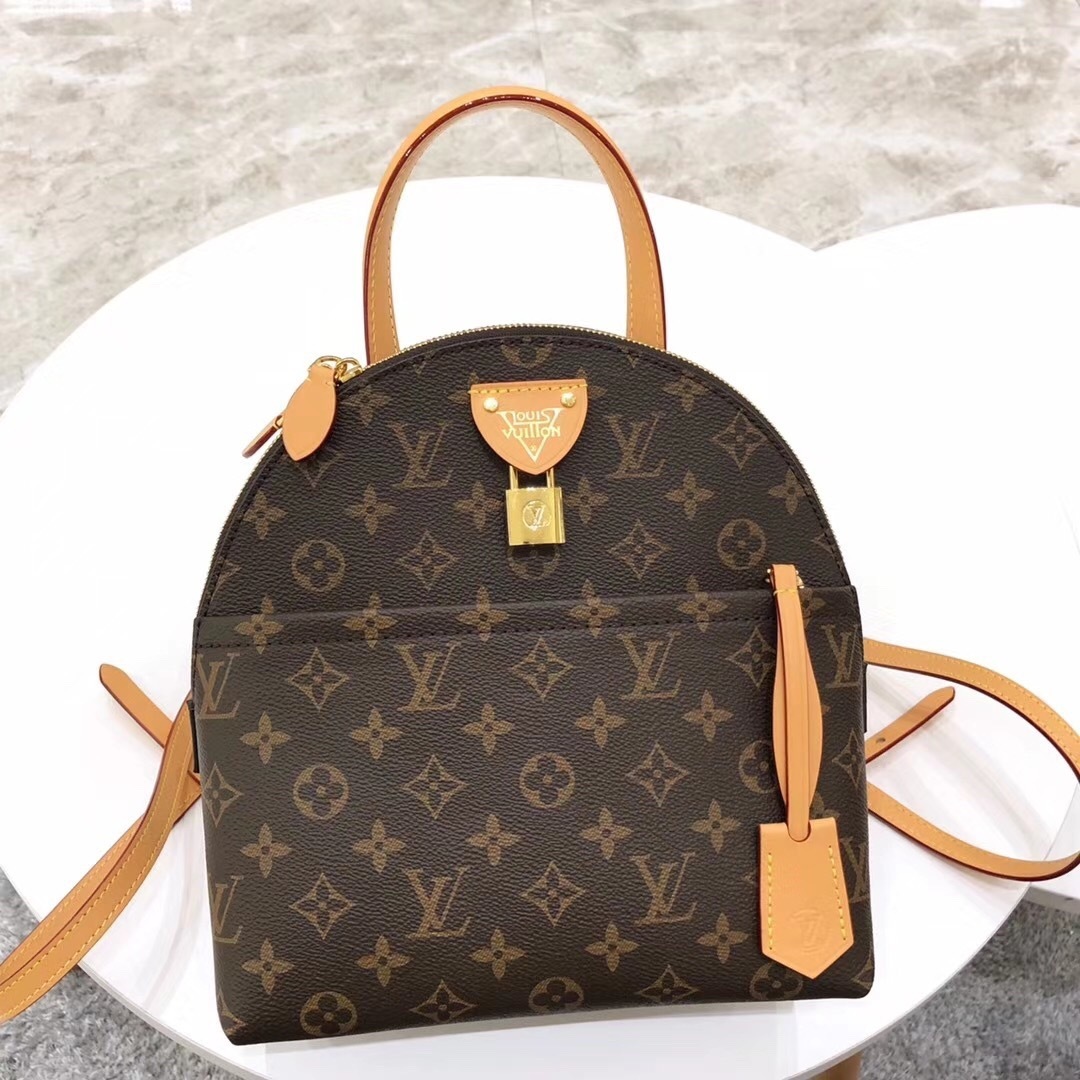 LV Alma Backpack in Monogram coated canvas