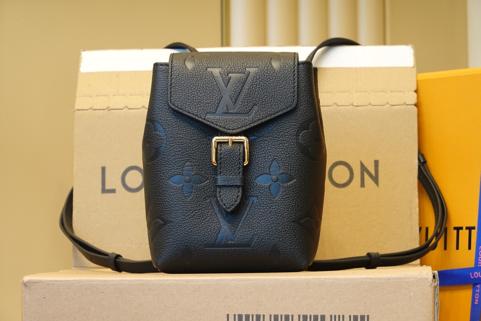 LV Tiny Backpack in black Monogram Empreinte leather