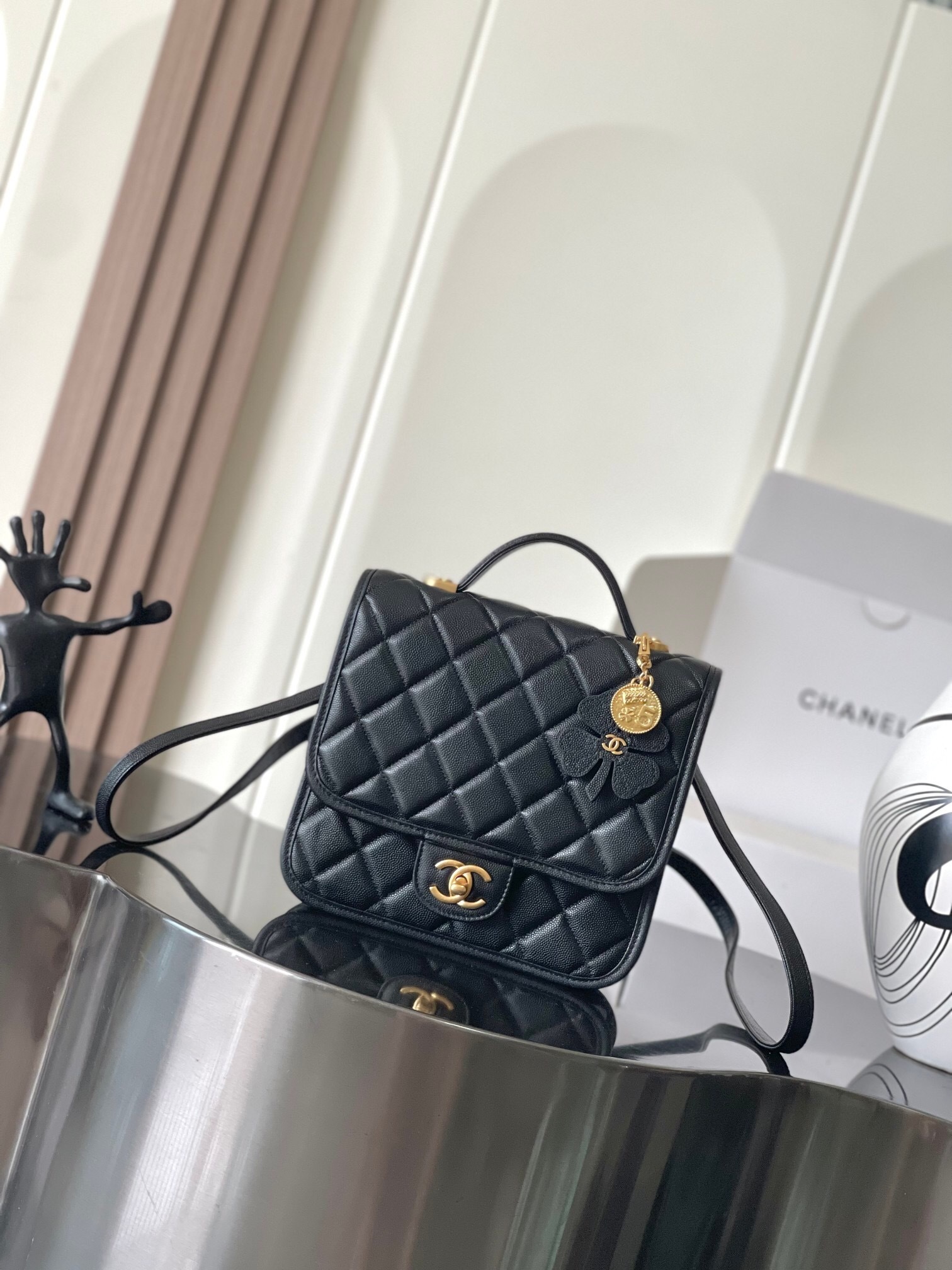 Chanel black quilted shoulder handbag with a top handle gold-tone CC logo clasp