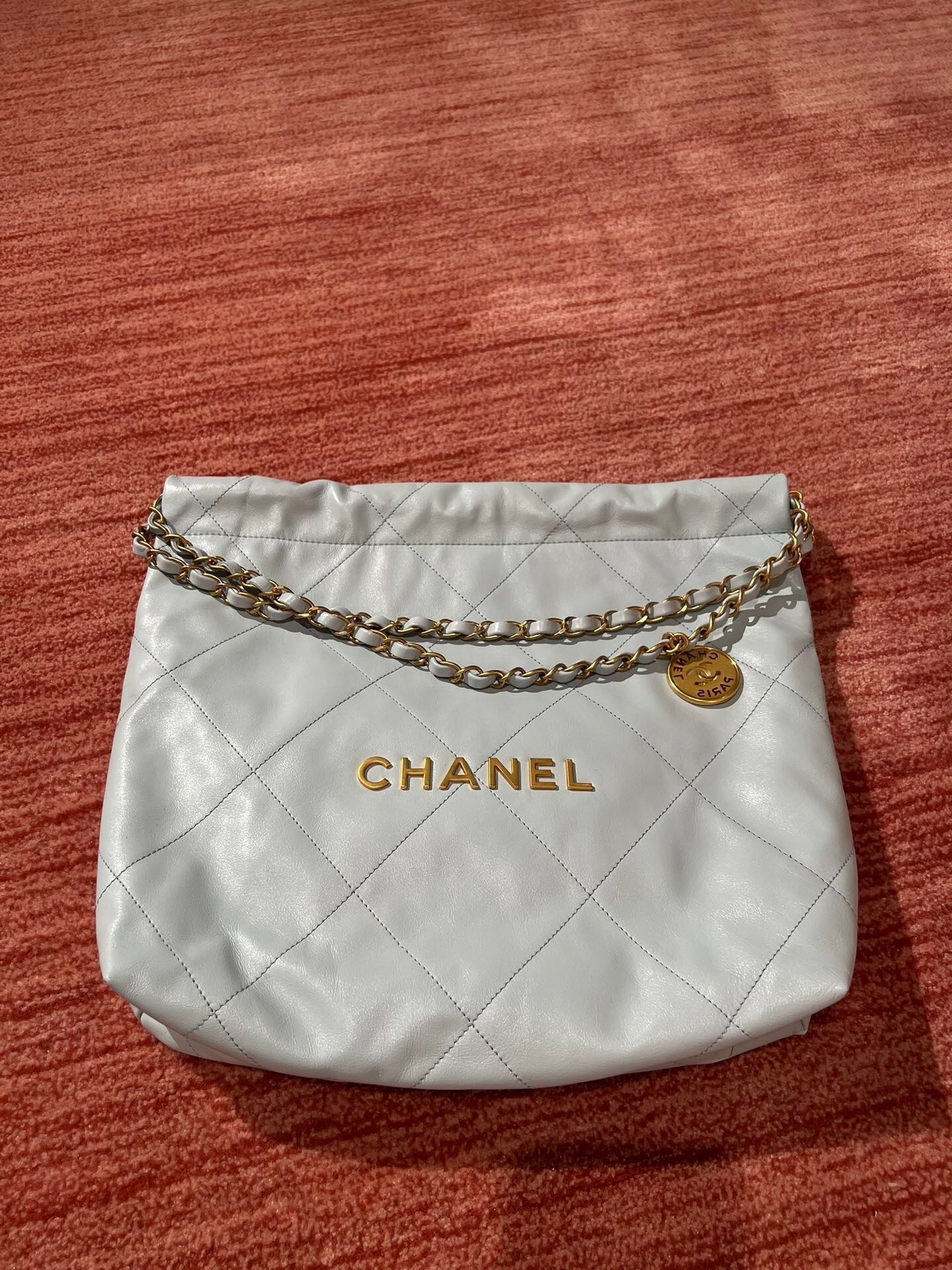 Chanel 22 sling handbag grey calfskin leather.