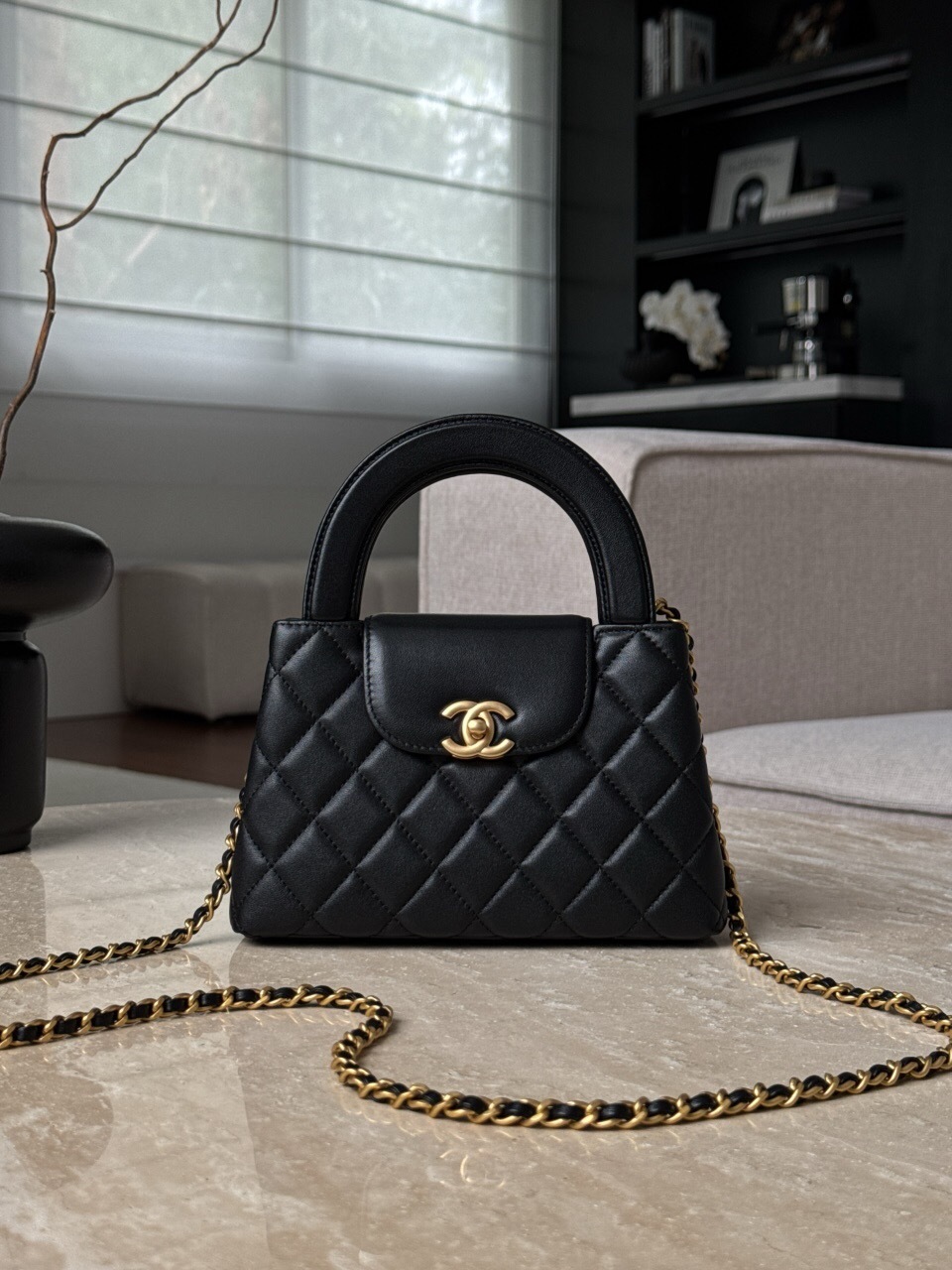 Chanel Kelly bag black with a quilted pattern and gold-tone hardware