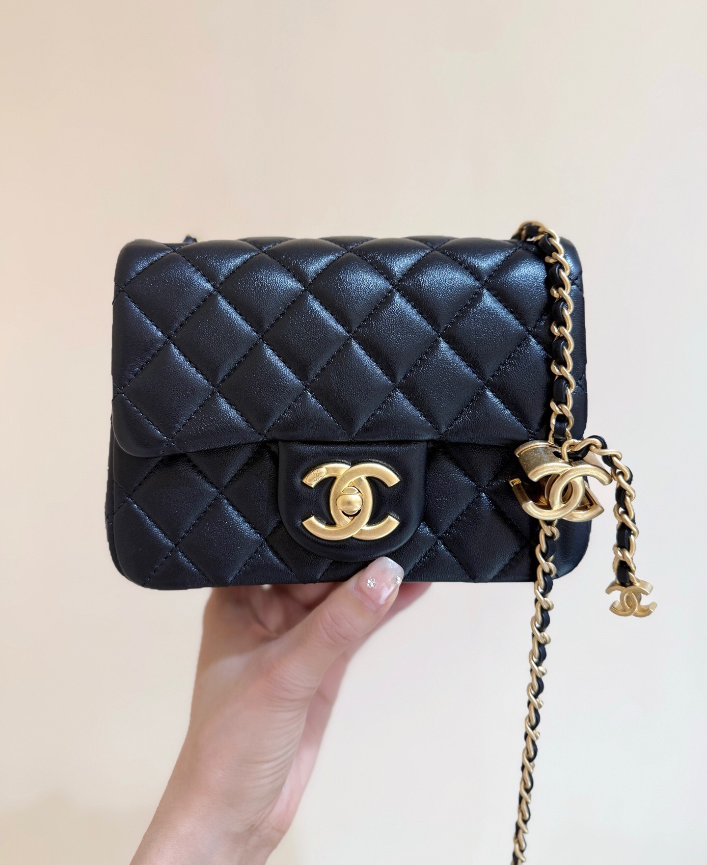 Chanel Mini Flap Bag black with gold-tone hardware.