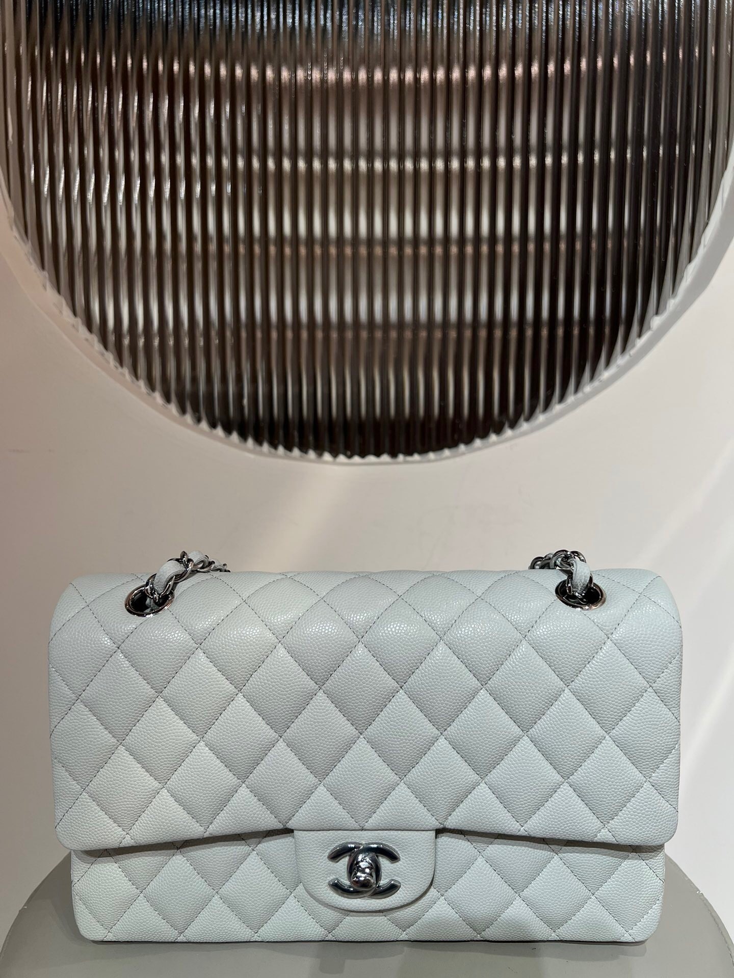Chanel Classic Flap bag in quilted caviar leather.