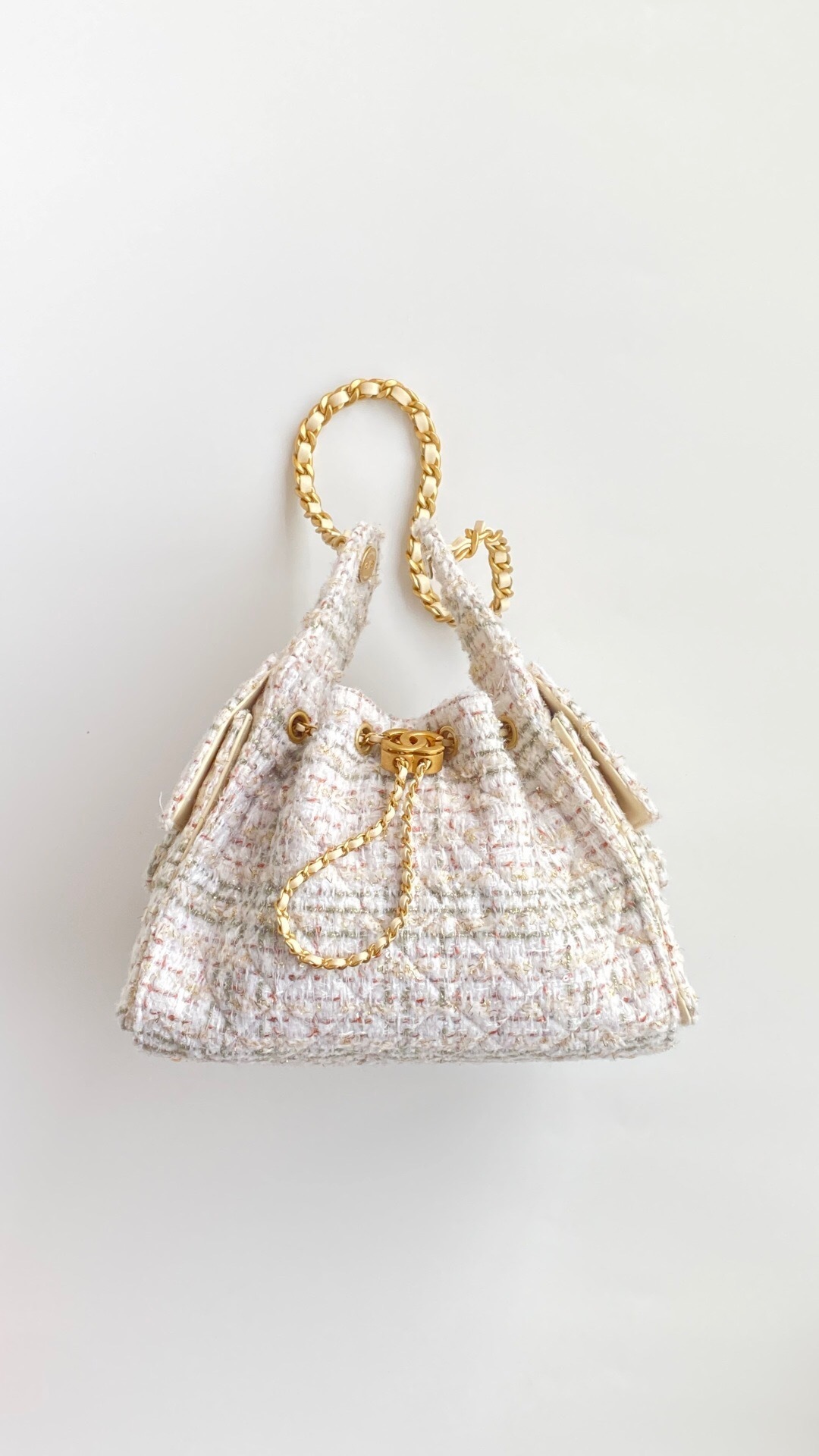 Chanel 25 Small Handbag tweed with gold-tone metal hardware.