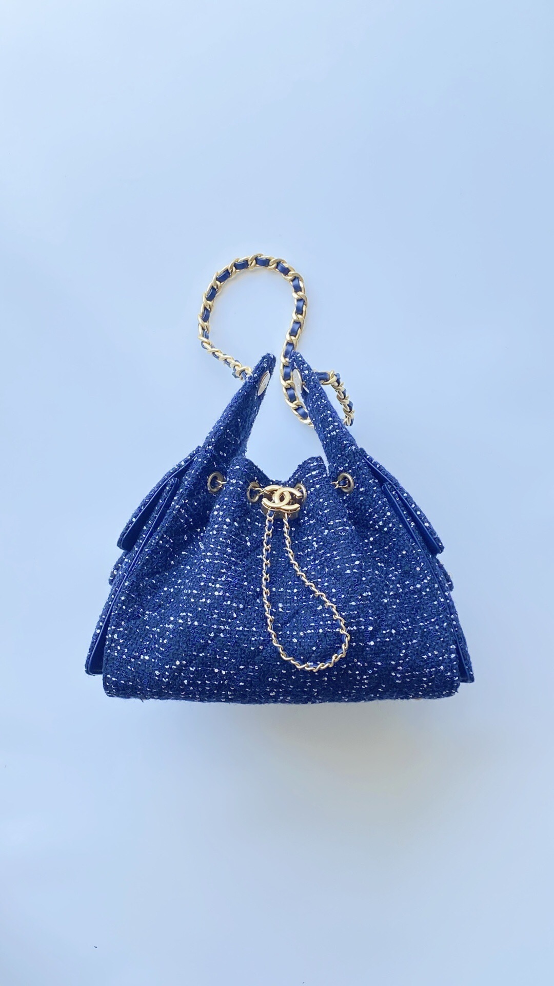 Chanel 25 small handbag in wool tweed and gold-tone metal bucket bag