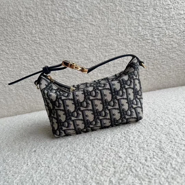 Dior Travel Nomad medium pouch bag in blue Dior Oblique jacquard.