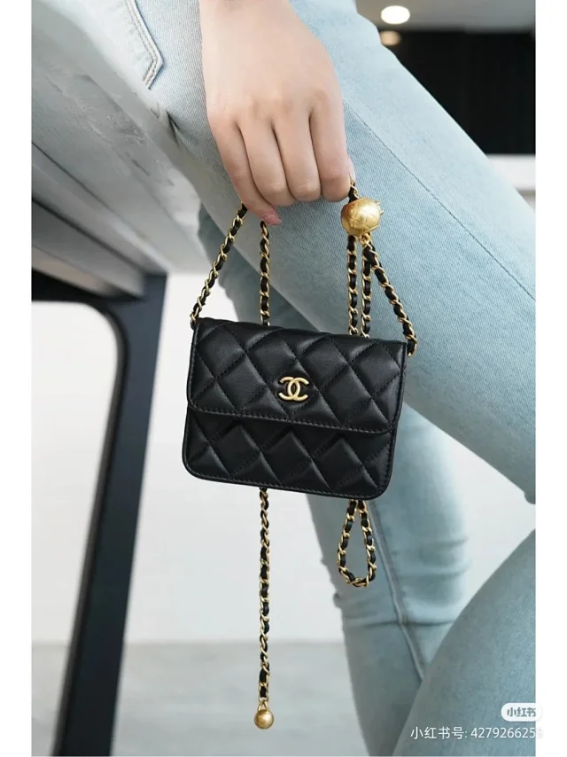 Chanel Matelasse shoulder bag black with a gold chain strap and a gold-tone CC turn-lock closure