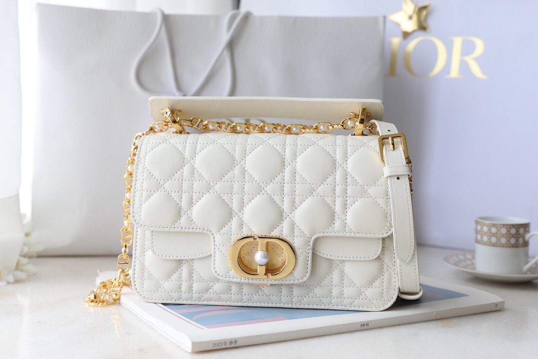 Dior Jolie Top Handle bag in latte cannage calfskin with a chain strap and a gold-finish metal CD signature.