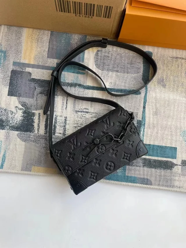 LV Steamer Wearable Wallets made from Monogram-embossed Taurillon leather with black hardware