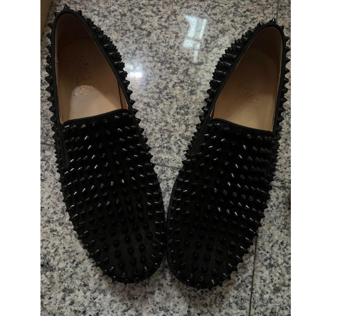 Christian Louboutin Roller-Boat sneakers in black calfskin with tonal spikes