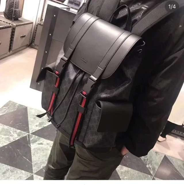 Gucci GG Supreme backpack in black with the signature Web-stripe trim