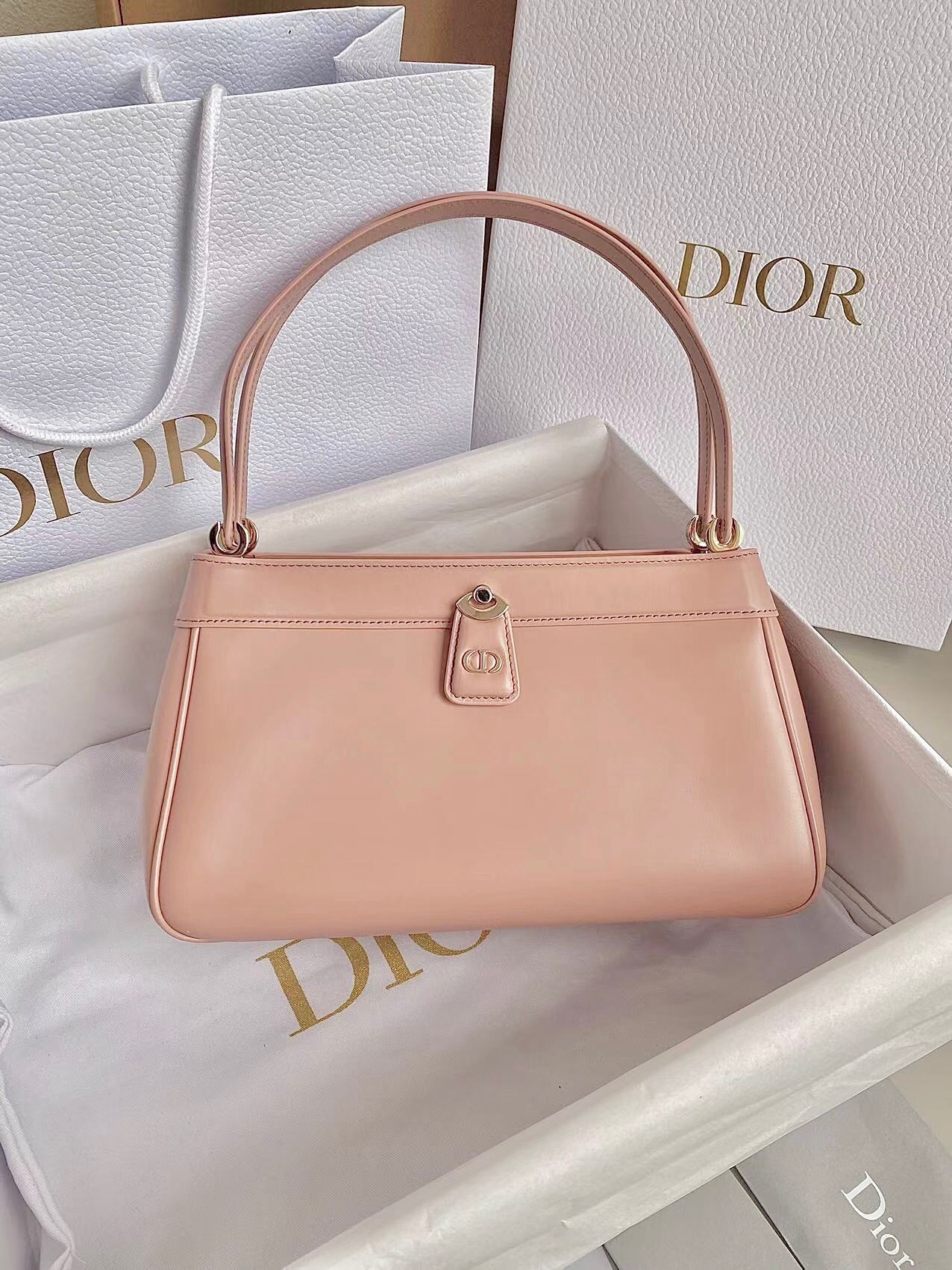 Dior Key Medium shoulder bag in a dusty ivory or pink shade