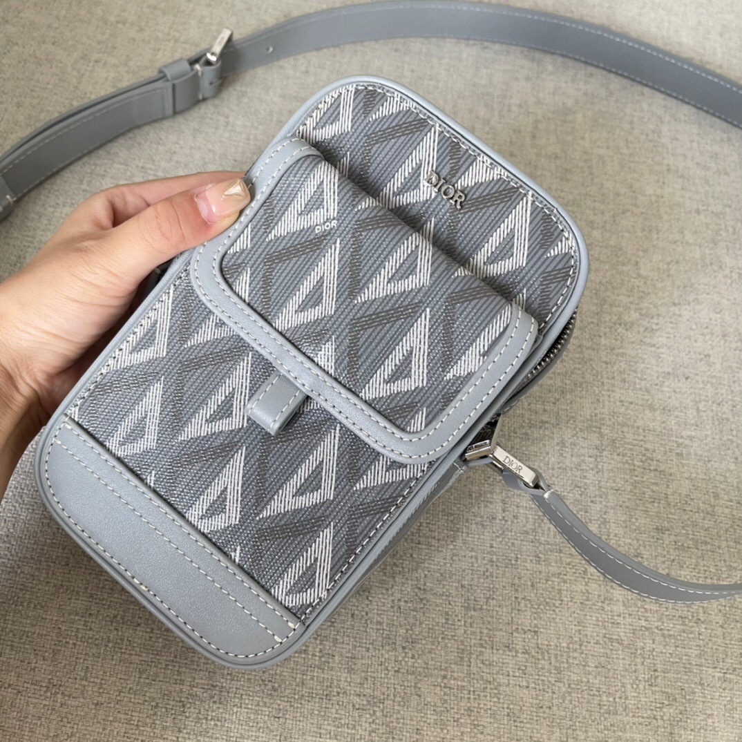 Dior Hit The Road vertical pouch in gray CD Diamond canvas with smooth calfskin details.