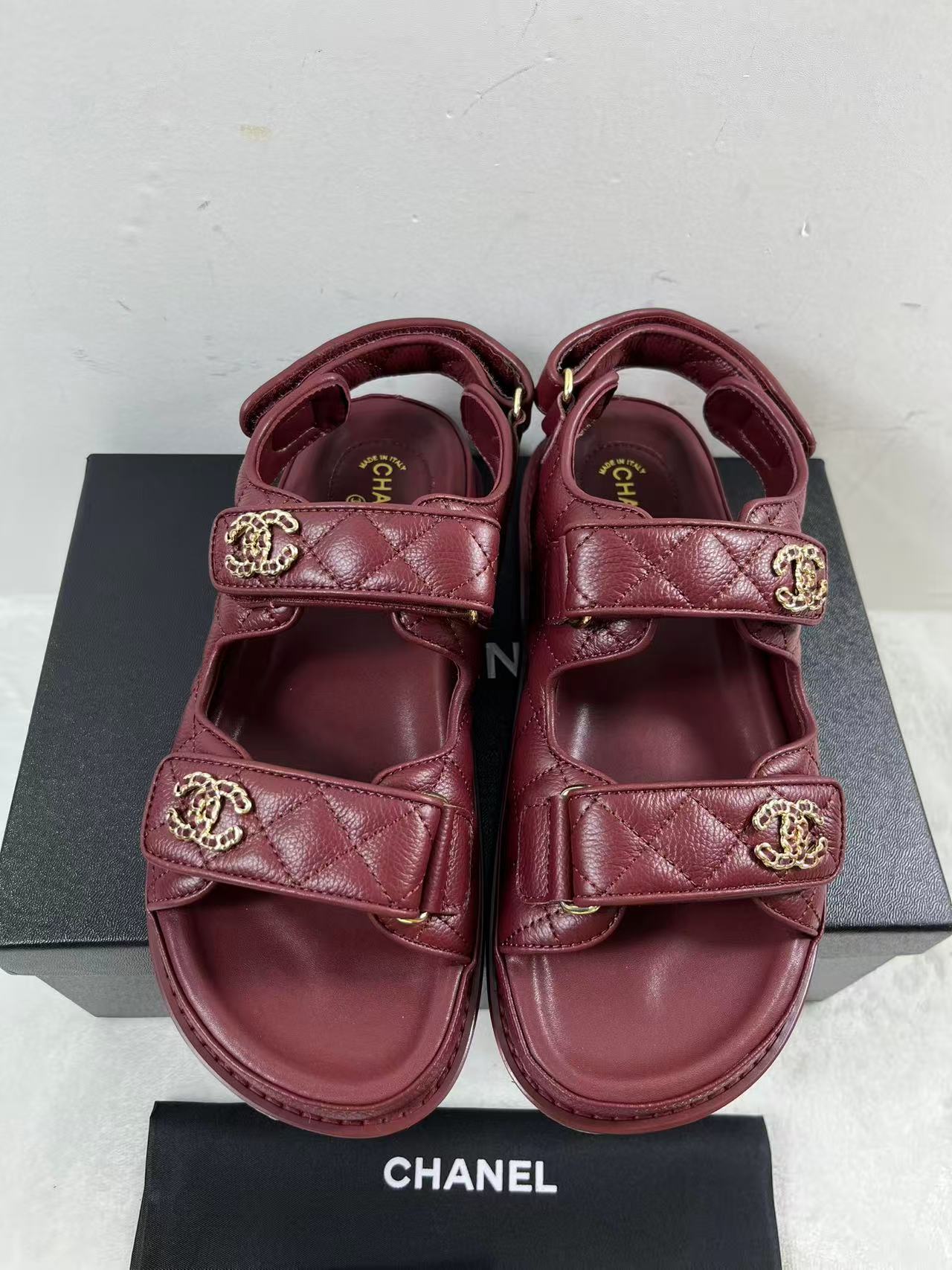 Chanel Dad sandals with burgendy quilted leather straps and the signature CC logo