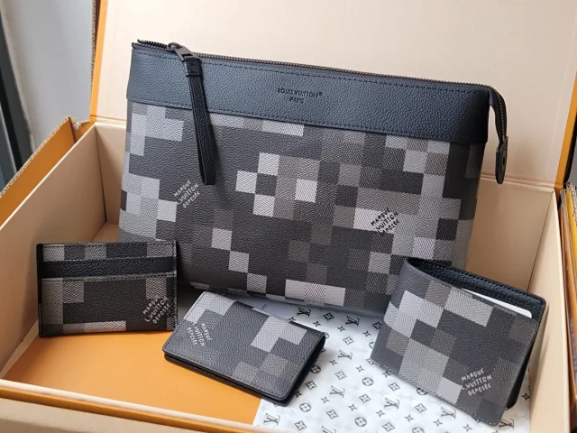 LV Pochette Voyage Souple in the Damoflage Black coated canvas