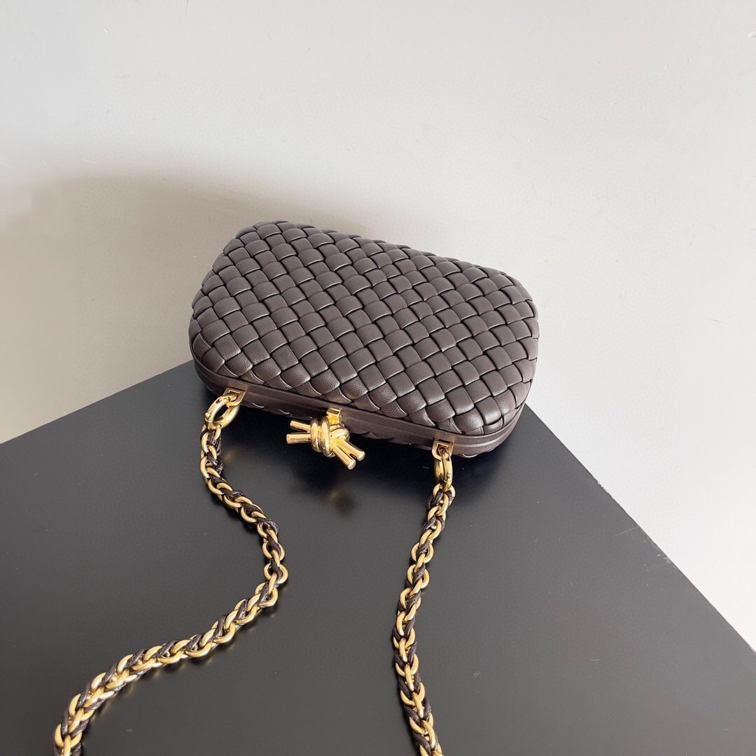 Bottega Veneta Knot clutch Intrecciato woven leather design and a knot-shaped clasp