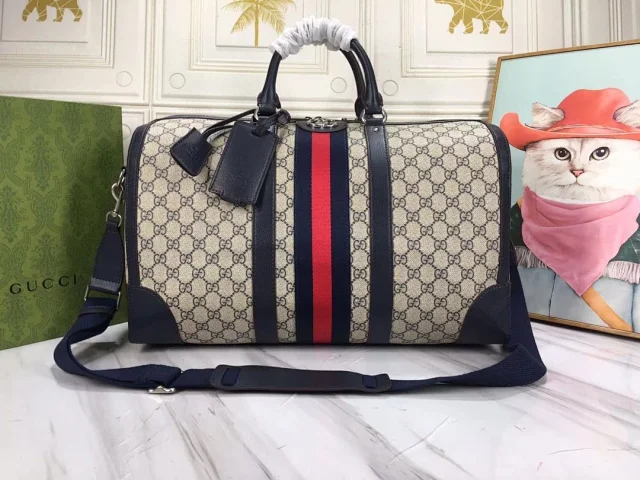 Gucci Savoy medium duffle bag in beige and blue GG Supreme canvas with blue leather trim and a blue and red Web stripe