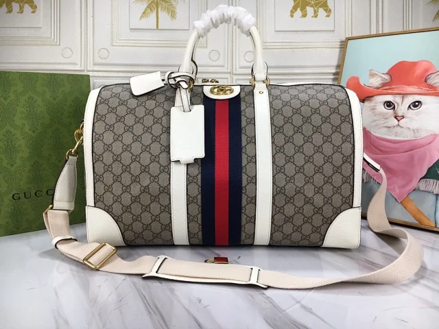 Gucci Savoy duffle bag in the GG Monogram coated signature webbing and leather trims