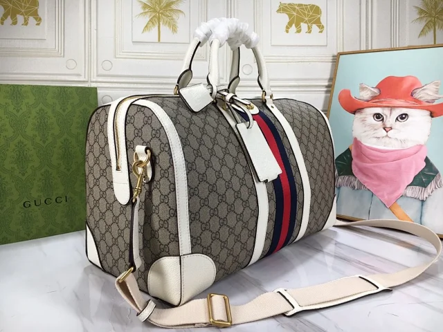 Gucci Savoy duffle bag in the GG Monogram coated signature webbing and leather trims