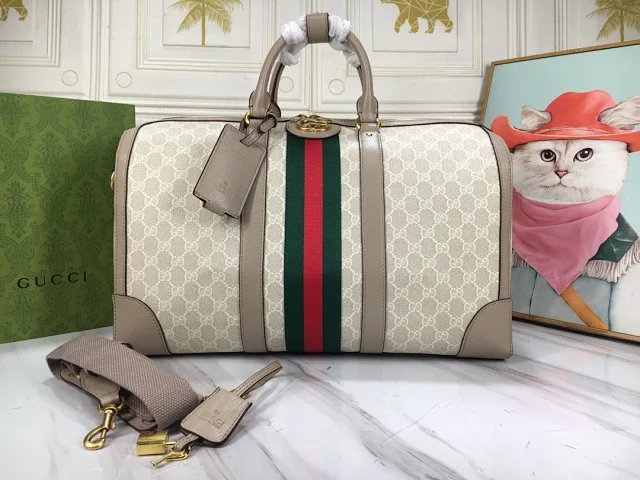 Gucci GG Supreme Monogram Textured Dollar Calfskin Web Medium Savoy Duffle Bag in beige, mystic white, and oatmeal