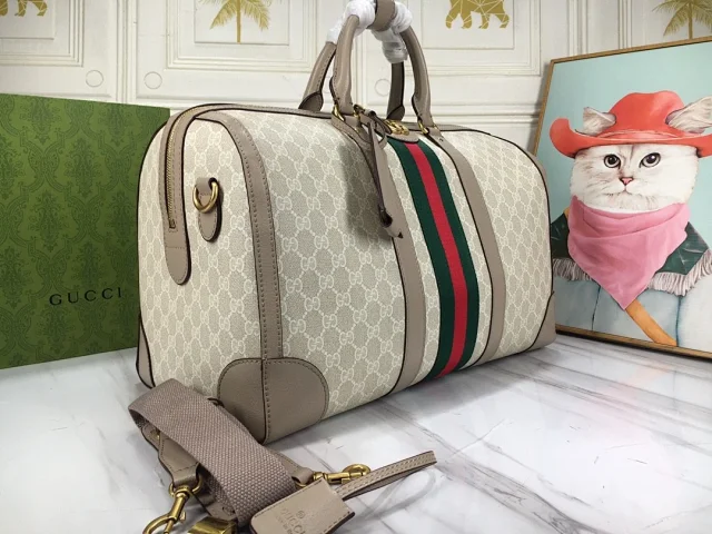 Gucci GG Supreme Monogram Textured Dollar Calfskin Web Medium Savoy Duffle Bag in beige, mystic white, and oatmeal