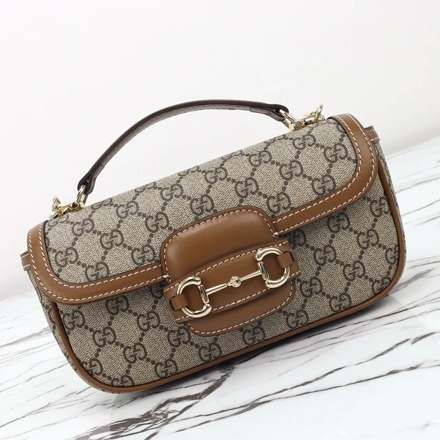 Gucci Horsebit 1955 shoulder bag in beige and ebony GG Supreme canvas with brown leather finishes.