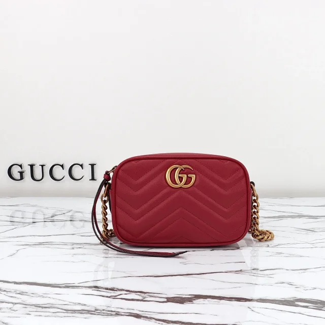 Gucci GG Marmont small shoulder bag in red matelassé chevron leather.