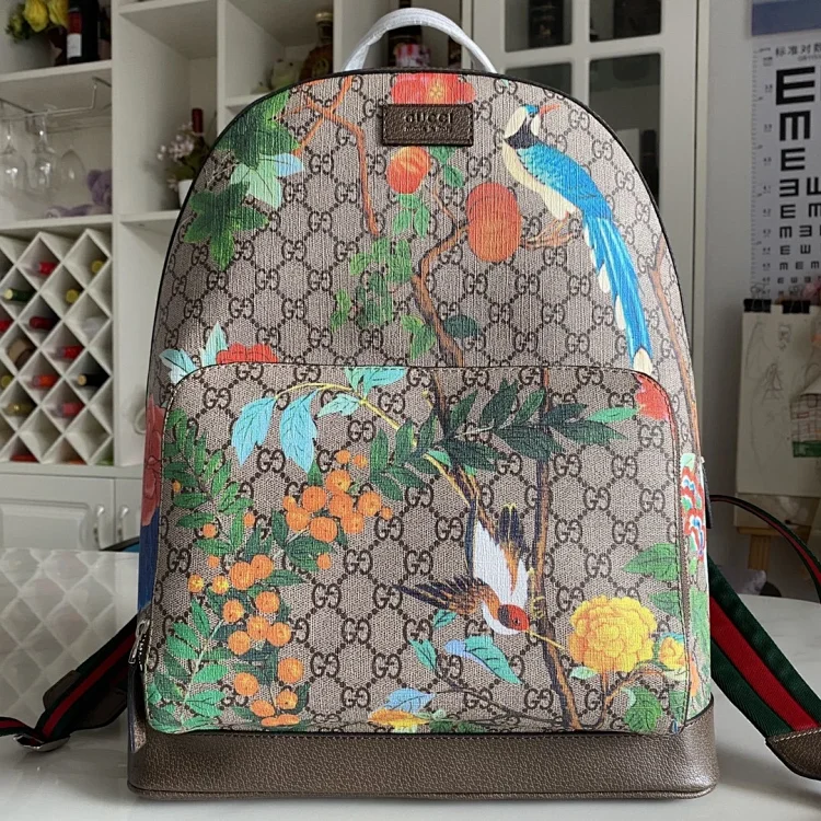 Gucci Tian GG Supreme Backpack in beige with a multicolor floral and bird print