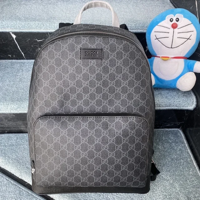 Gucci GG Supreme backpack in black canvas with black leather trim