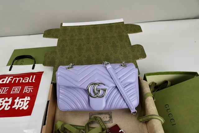Gucci GG Marmont small shoulder bag in a lilac or light purple color