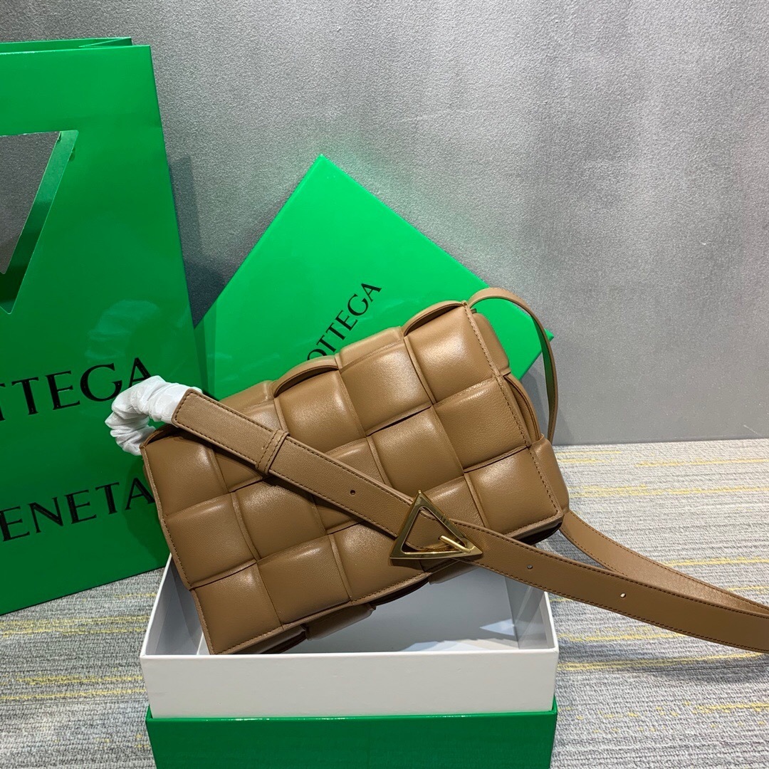 Bottega Veneta Padded Cassette crossbody bag in a light brown or caramel leather finish
