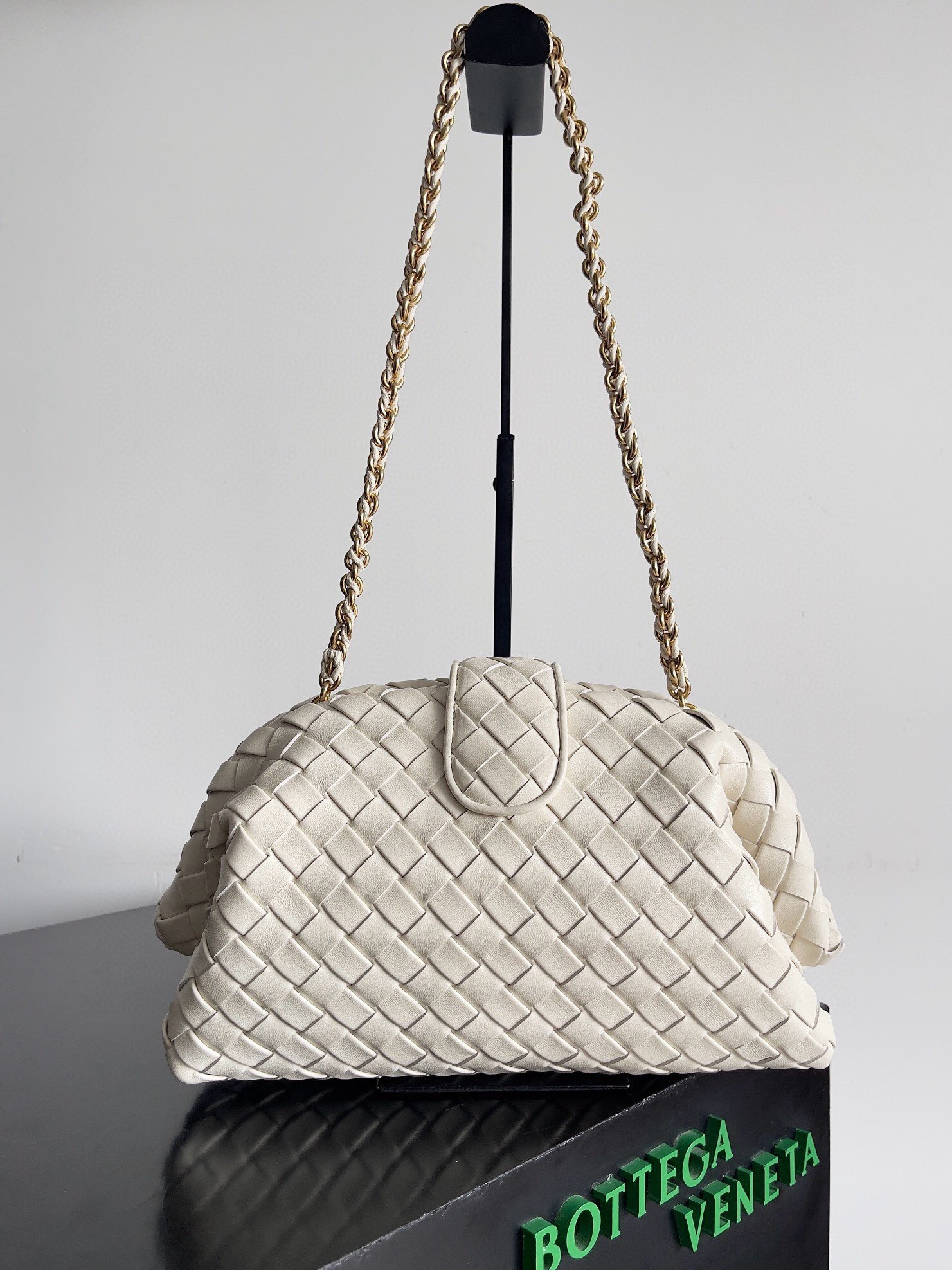 Bottega Veneta Lauren 1980 clutch bag in padded Intrecciato leather with a braided metal chain