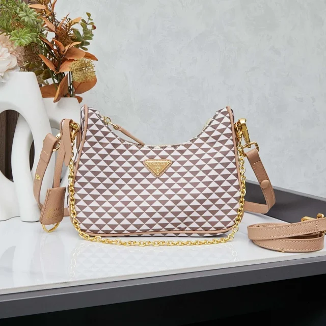 Prada designer shoulder bag with a brown and white geometric pattern and a gold chain strap