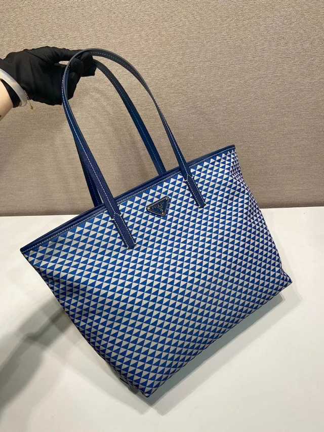 Prada padded Re-Nylon tote bag navy blue patchwork motif.