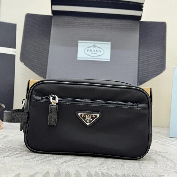 Prada Re-Nylon wash bag in black with Saffiano leather trim and an enamel triangle logo tote bag