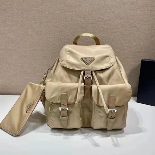 Prada Re-Nylon medium backpack in a beige Saffiano leather details and an enameled metal triangle logo.