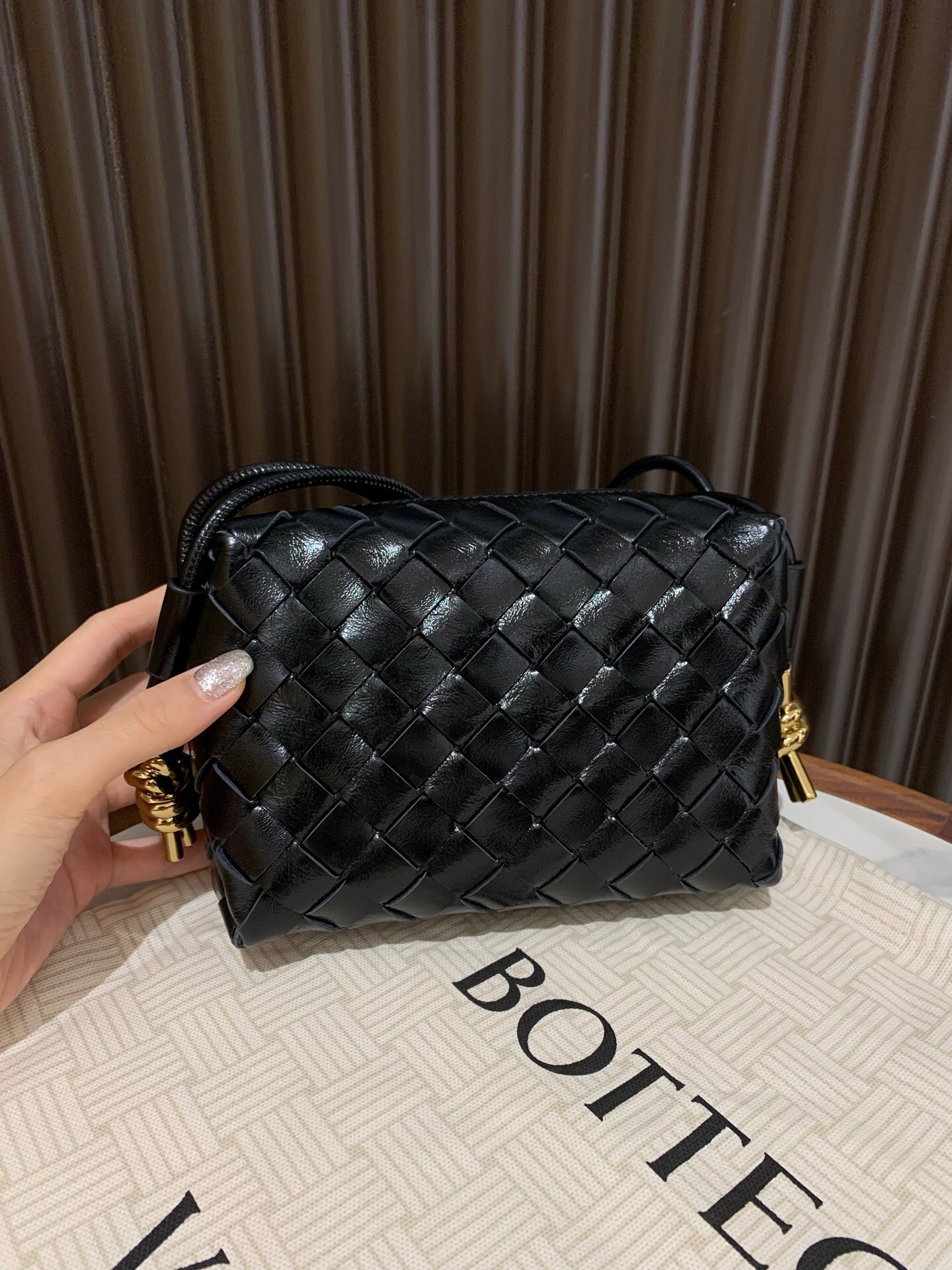 Bottega Veneta Mini Loop Camera Bag made of lambskin leather with a signature Intrecciato design black