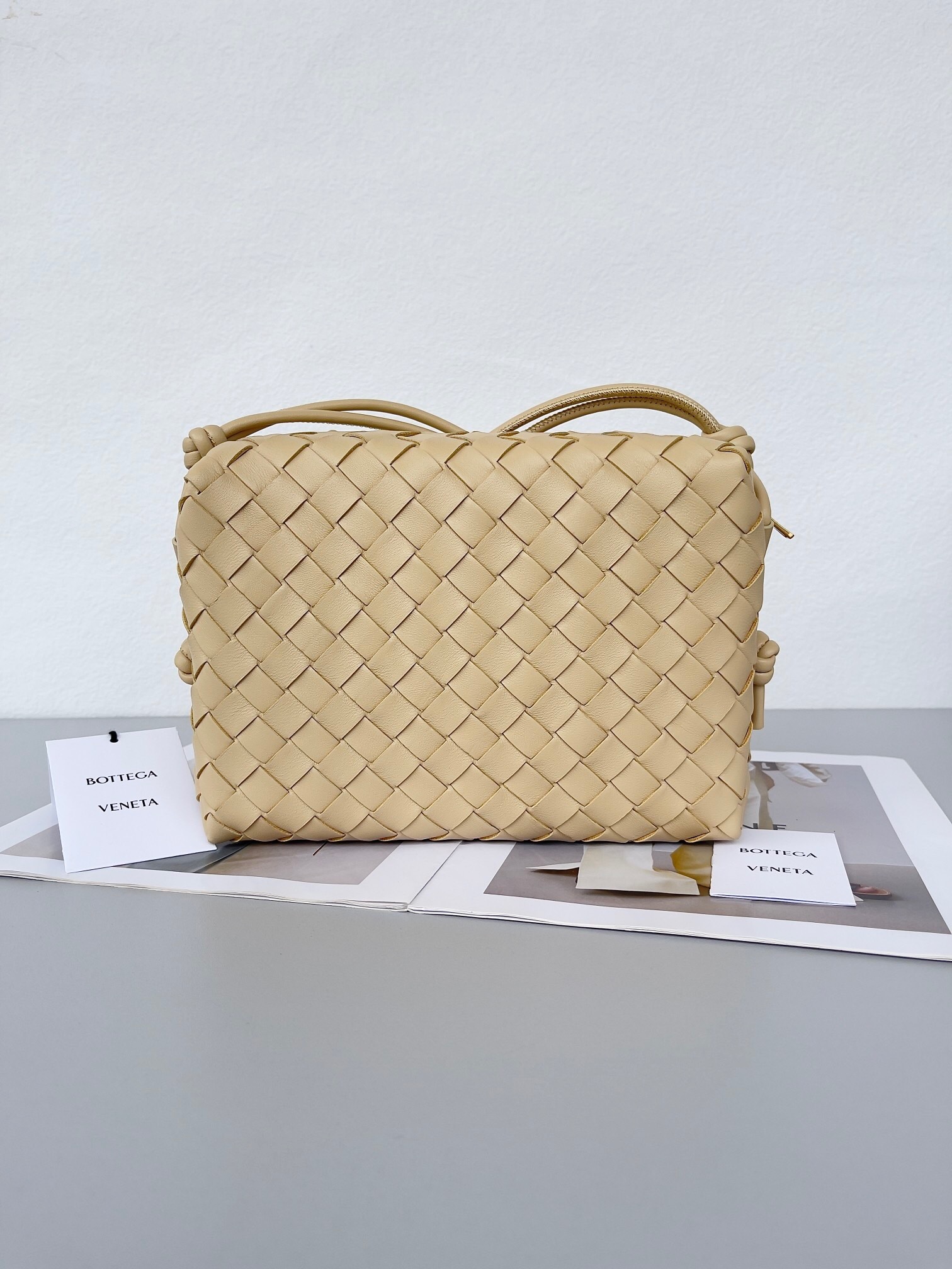 Bottega Veneta Mini Loop Camera Bag in almond or travertine leather