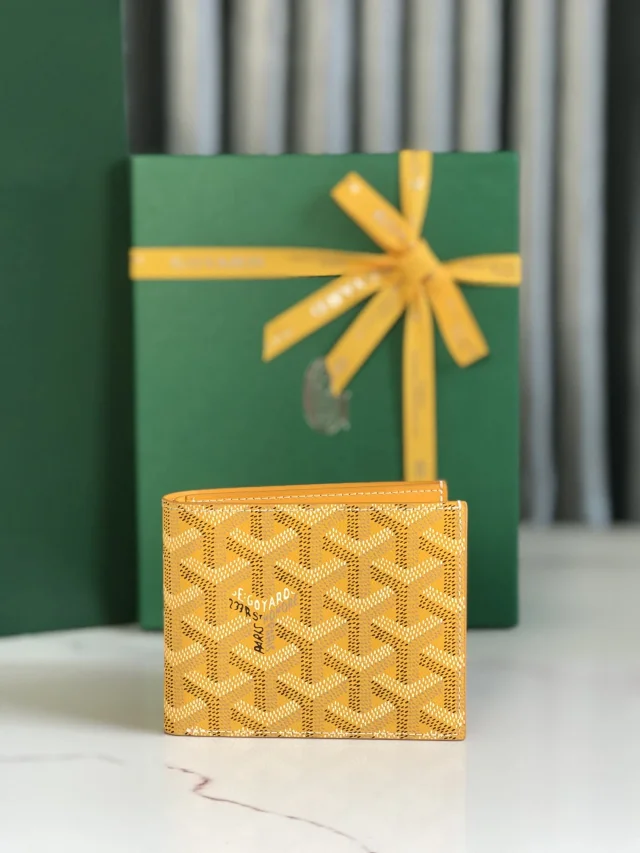 Goyard Victoire Wallet in yellow, crafted from Goyardine Canvas and Vauzelles Calfskin