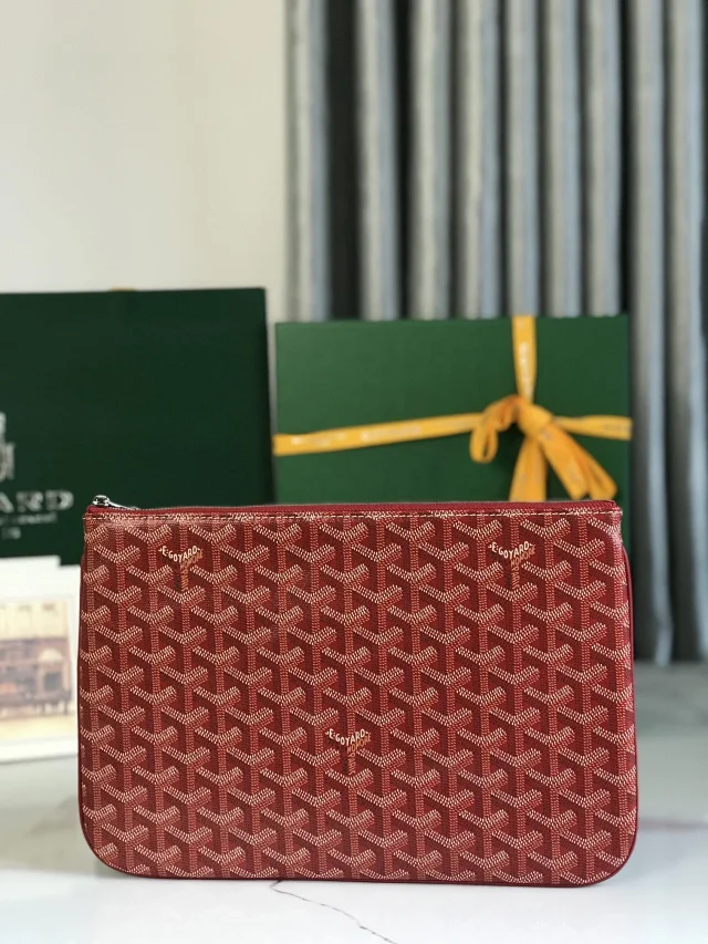 Goyard Senat MM Pouch in the Bordeaux color with the brand's signature Goyardine canvas