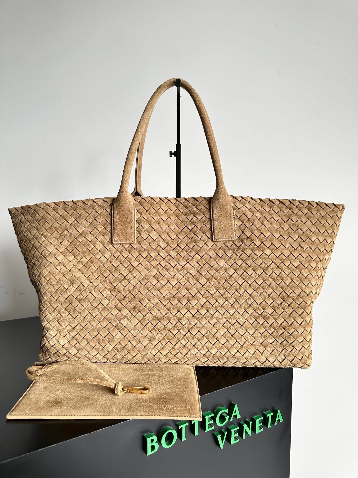 Bottega Veneta Cabat tote bag made with the signature intrecciato weave in suede or leather