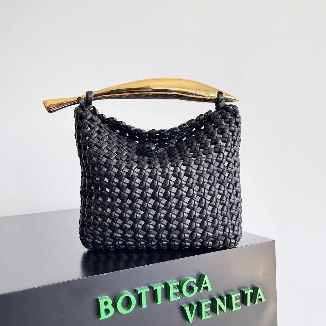 Bottega Veneta Sardine bag woven leather body and a sculpted metal top handle.