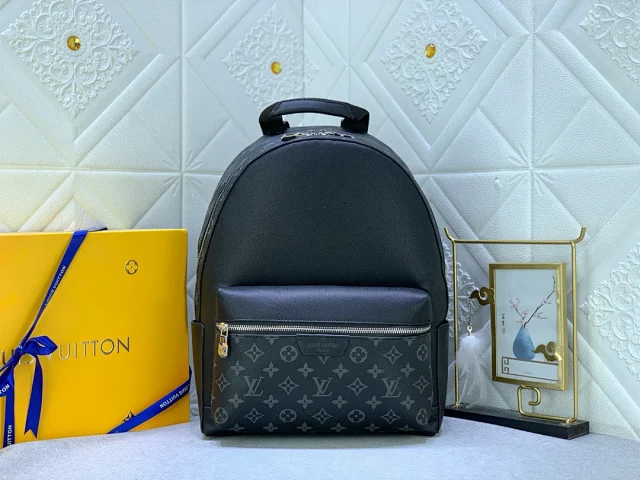 LV Discovery Backpack Monogram Macassar coated canvas with black cowhide-leather trim.