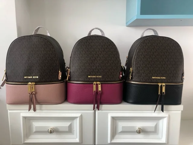 Michael Kors Rhea Medium Colorblock Signature Logo Backpack in coated canvas.