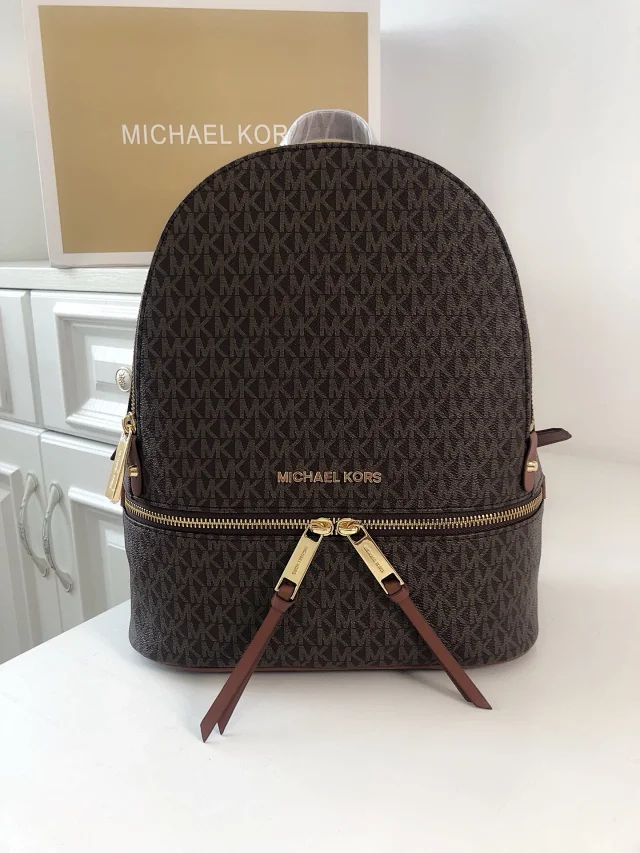 Michael Kors Rhea Zip Medium Signature Logo Backpack in brown