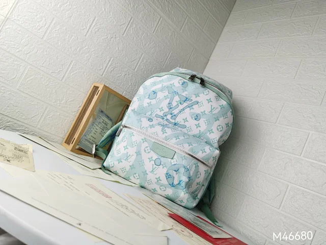 LV Discovery Backpack in Monogram Aquagarden canvas.