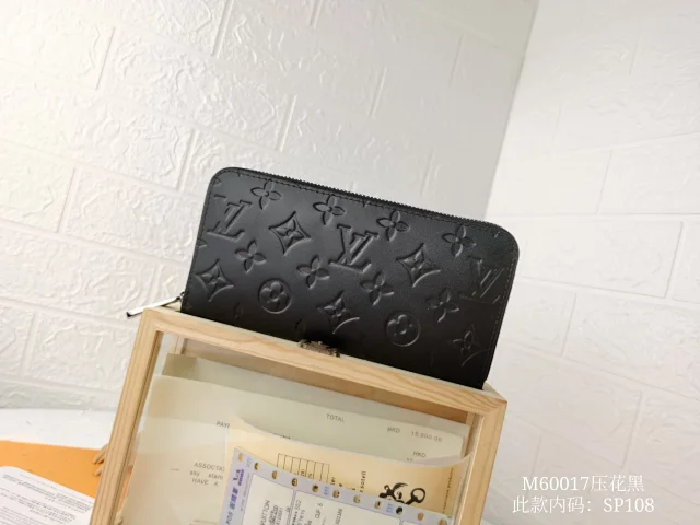 LV Zippy wallet in black with the Monogram Empreinte pattern.