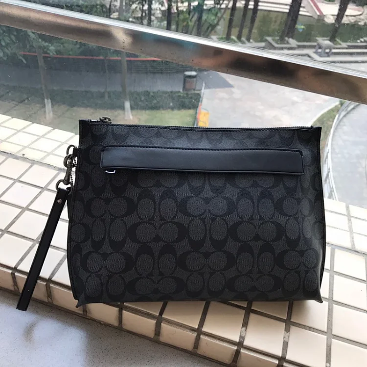 Coach Outlet Carryall Pouch in Signature Canvas Men's Accessories bag