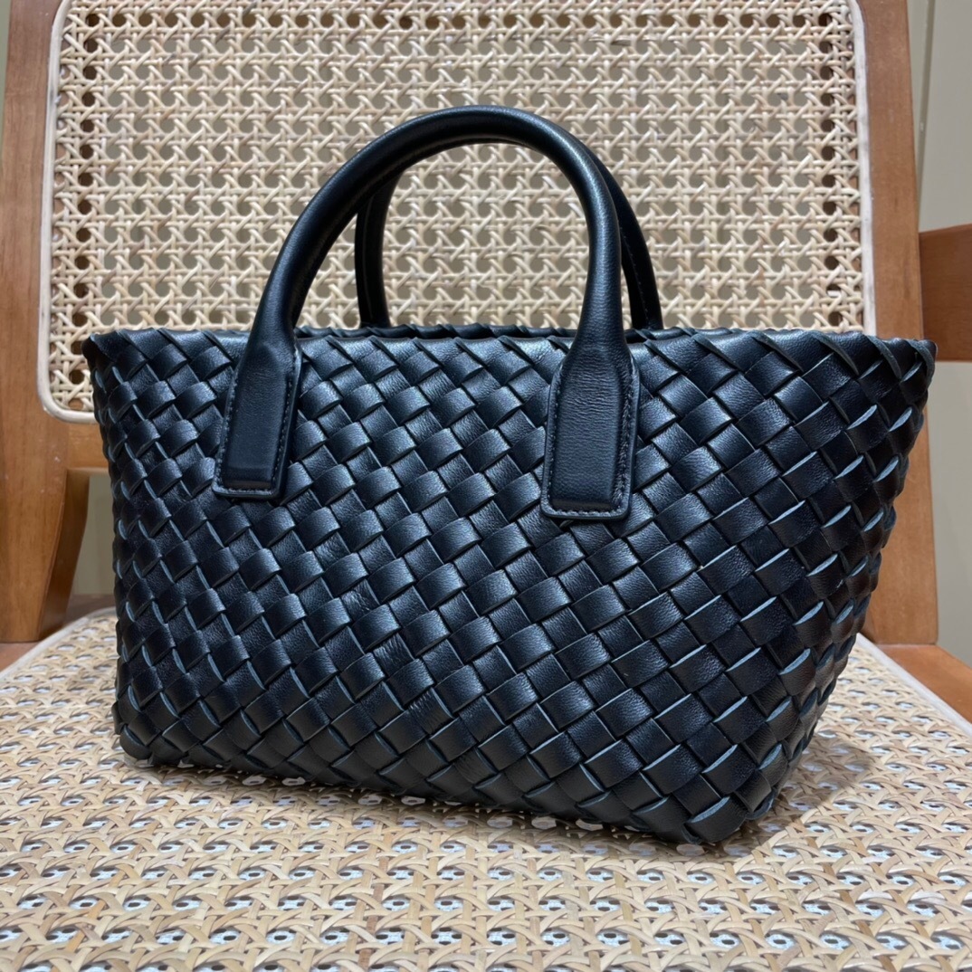 Bottega Veneta Mini Cabat tote bag in black intrecciato leather.