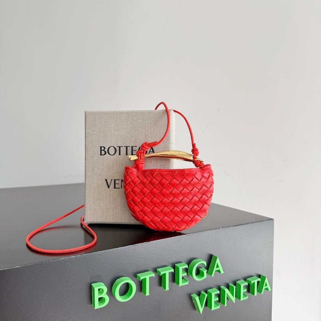 Bottega Veneta Mini Sardine bag in red intrecciato leather with a sculptural gold-tone handle shoulder bag